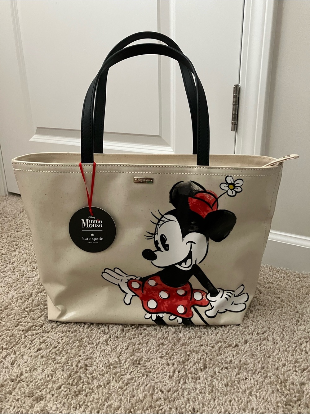 kate spade cream tote with black handles and red Minnie Mouse accents